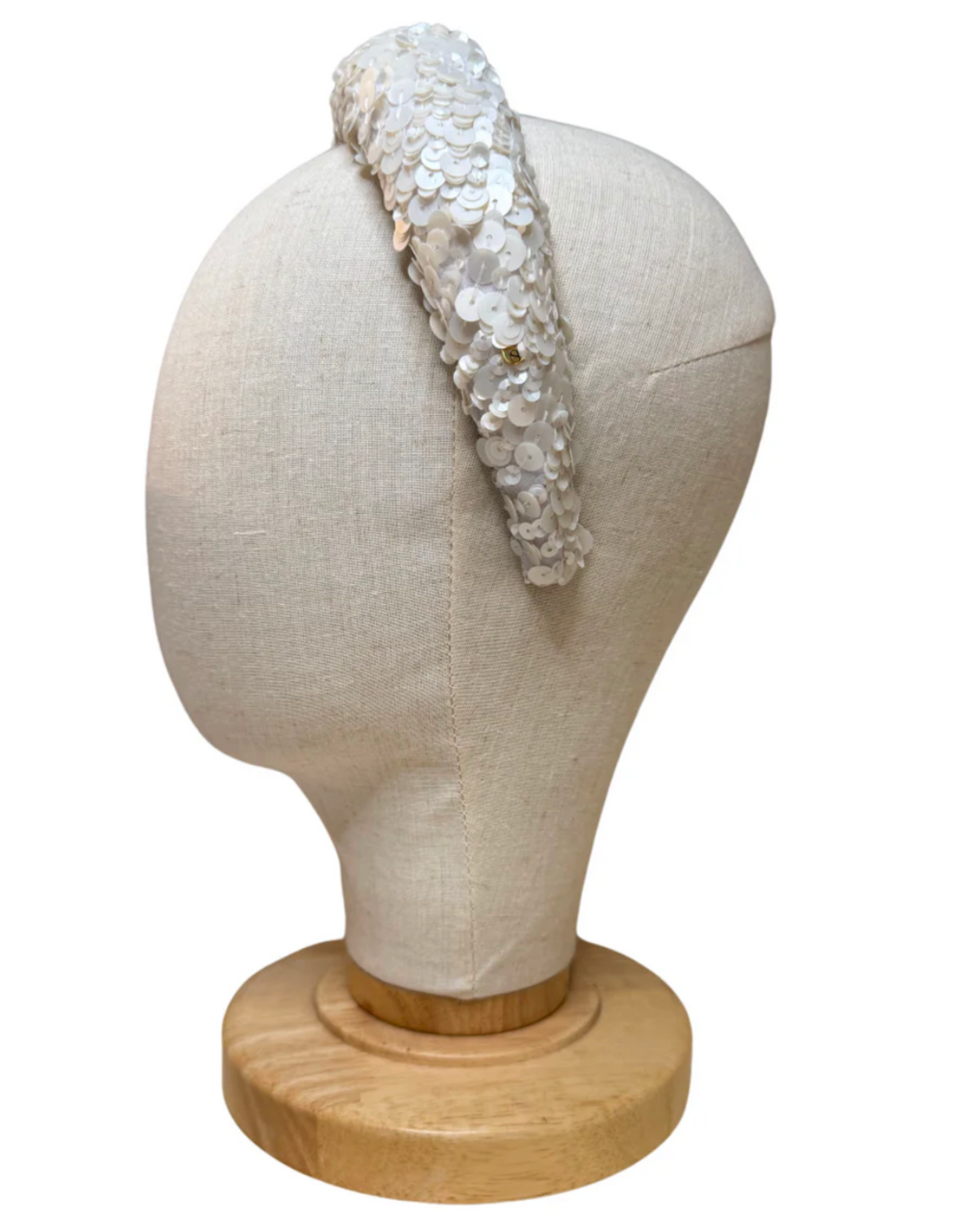 A hand-finished sequined headband featuring a removable French voilette for versatile elegance.